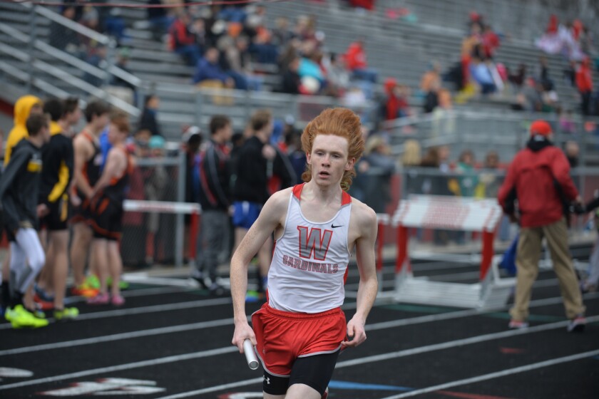 Shawn Mellies-U'Ren of Willmar runs the third leg of the 4x800 relay on Thursday at the Willmar Invitational at Hodapp Field. Curt Hogg / Tribune