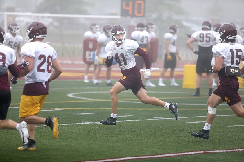 Bulldog defensive back Tim Pokornowski (41) runs through footwork drills with his teammates during practice
