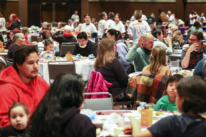 people gathering for community meal