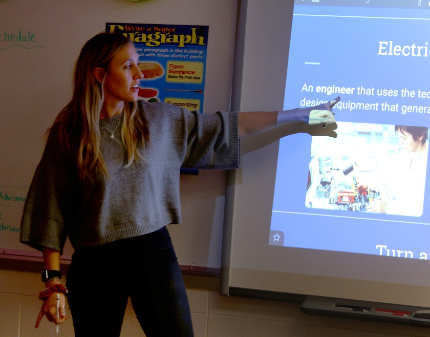 Kourtney Leuthold explains what electrical engineers do for her English learner students at Worthington Middle School Wednesday, March 9, 2022.