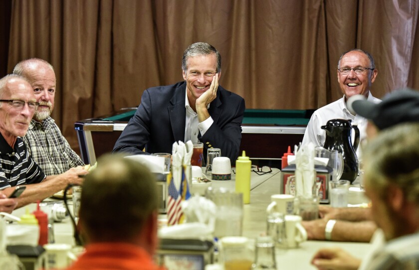 Sen. John Thune shares a laugh with members of the Scotland Rotrary Club including Greg Gemar, from left, Dick Behl and Jerry Nelson during a stop on Thursday at the Recreation Bar in Scotland. (Matt Gade/Republic)