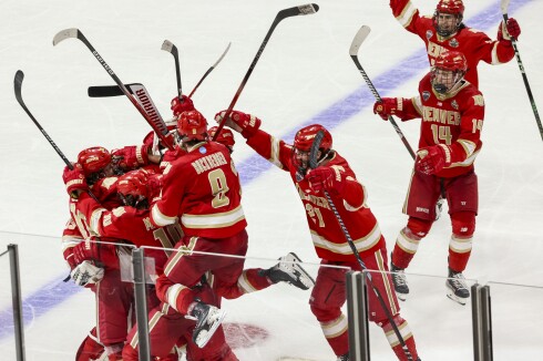 college men play ice hockey