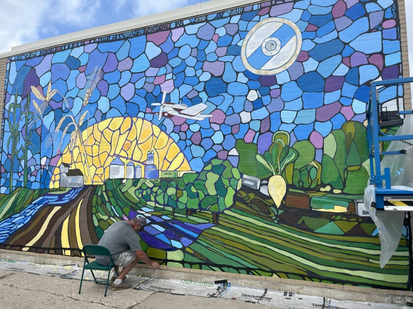 Eric Johnson seated mural.jpeg