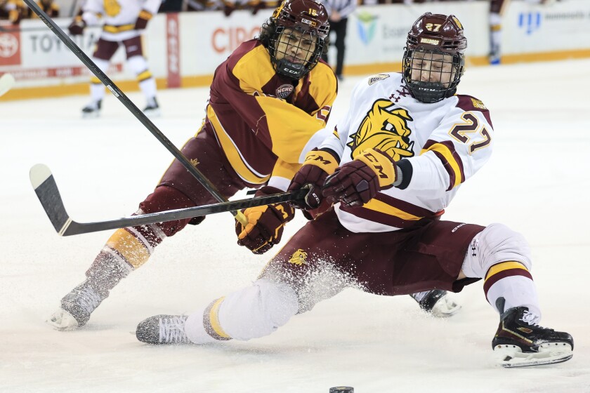 college men play ice hockey
