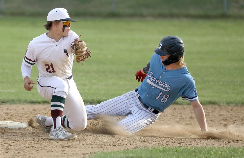 Superior’s Mason Stenberg (18) slides in under the tag of Northwood/Solon Springs’ Abe Ahlberg (21) at second base