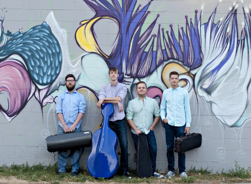 Altius Quartet -- Andrew Krimm (left), Zachary Reaves, Joshua Ulrich and Andrew Giordano will perform a recital at 2 p.m. Sunday, March 31, at Lutheran Church of the Cross in Nisswa. This quartet is the Lakes Area Music Festival's first ever String Quartet Fellowship. Submitted Photo