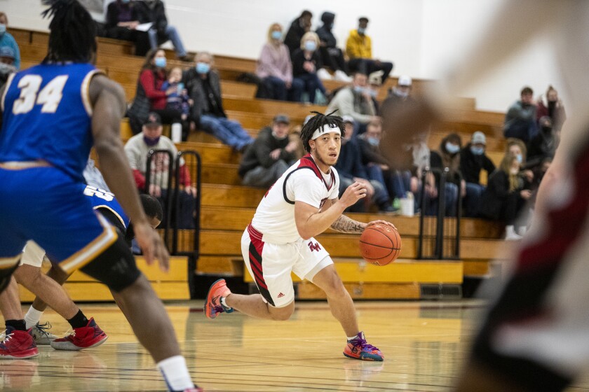 Ridgewater guard DJ Brown brings the ball up the court during a game against Anoka Ramsey at home in Willmar Feb. 9, 2022.