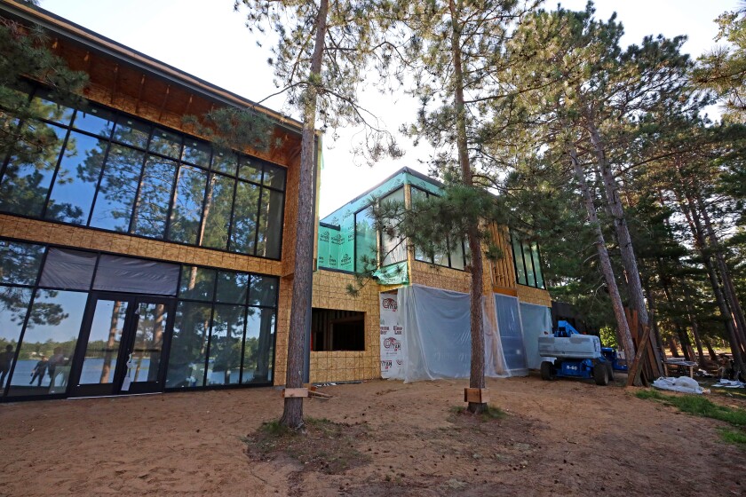 Unfinished building has floor-to-ceiling windows on one side
