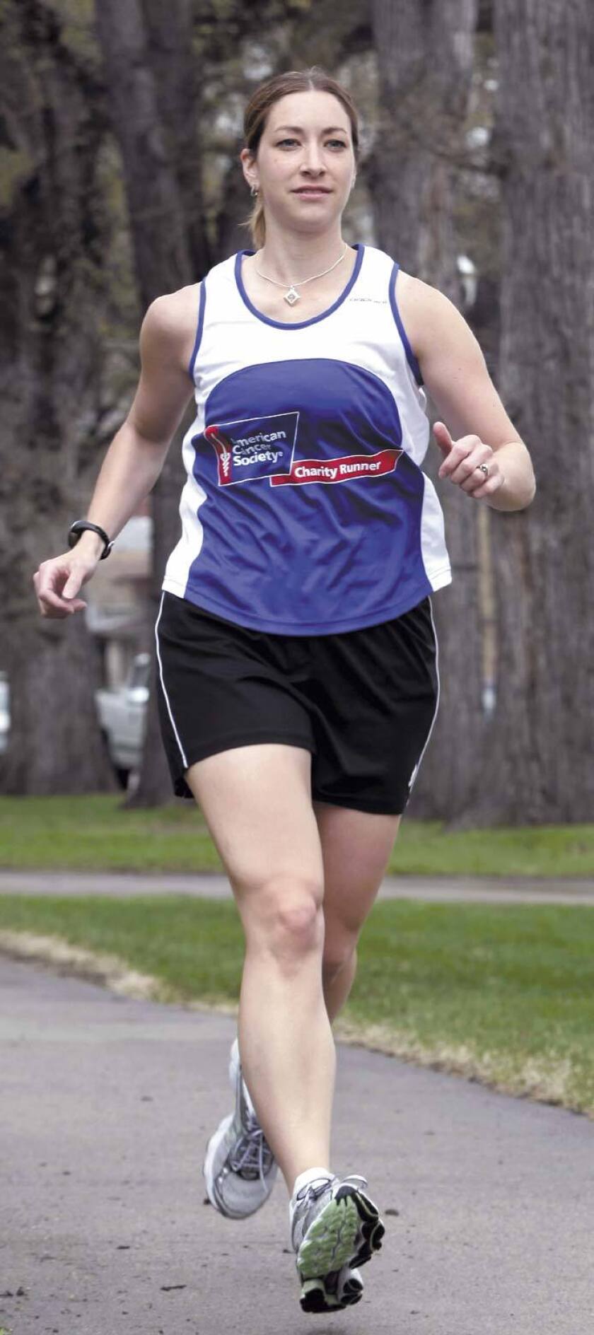Missy Larson stretches before a run
