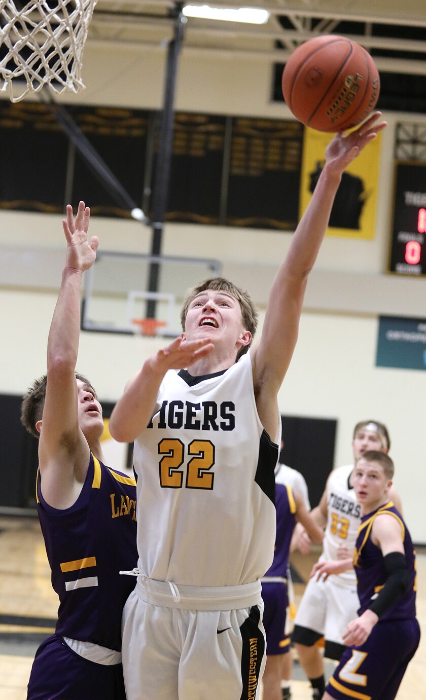 Northwestern’s Cole Lahti (22) scores a first half bucket