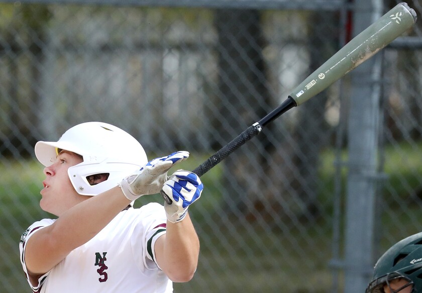 Abe Ahlberg (21) of Northwood/Solon Springs watches the ball go over the fence for a two-run home run