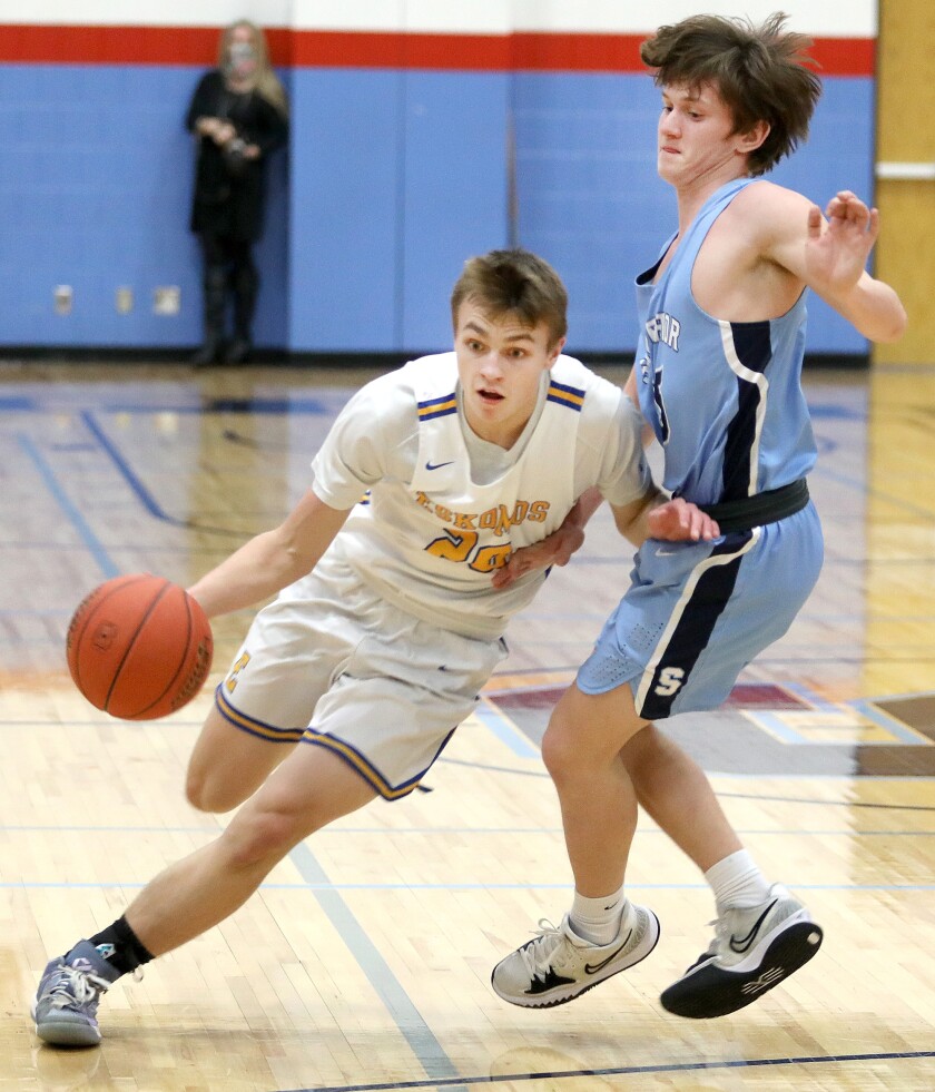 Esko’s Cuinn Berger (20) dribbles past Superior’s Jake Kidd (15)