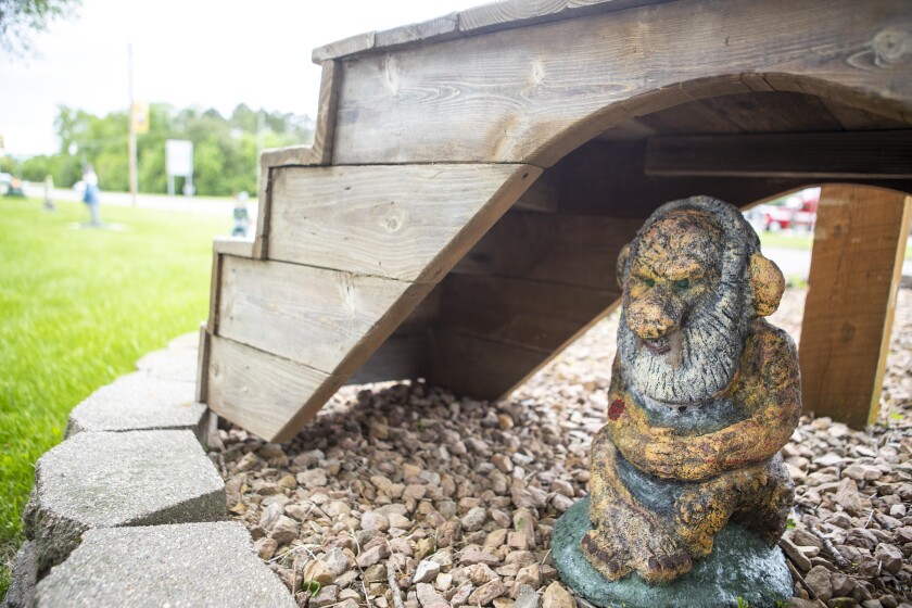 Covidius P. Evilson, a troll, sits under a bridge in the Dawson city park on Tuesday, May 31, 2022. Created in 2021, Covidius illustrates the 2020-2021 pandemic years, when Riverfest was canceled and there were no new gnomes. Instead of a heart on his sleeve he has the coronavirus molecule.