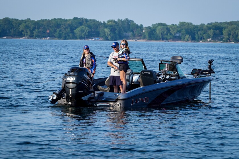 Lake Agassiz Fishing League girls and boat captain.jpg