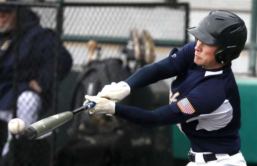 Hermantown’s Wyatt Carlson (4) connects on the ball