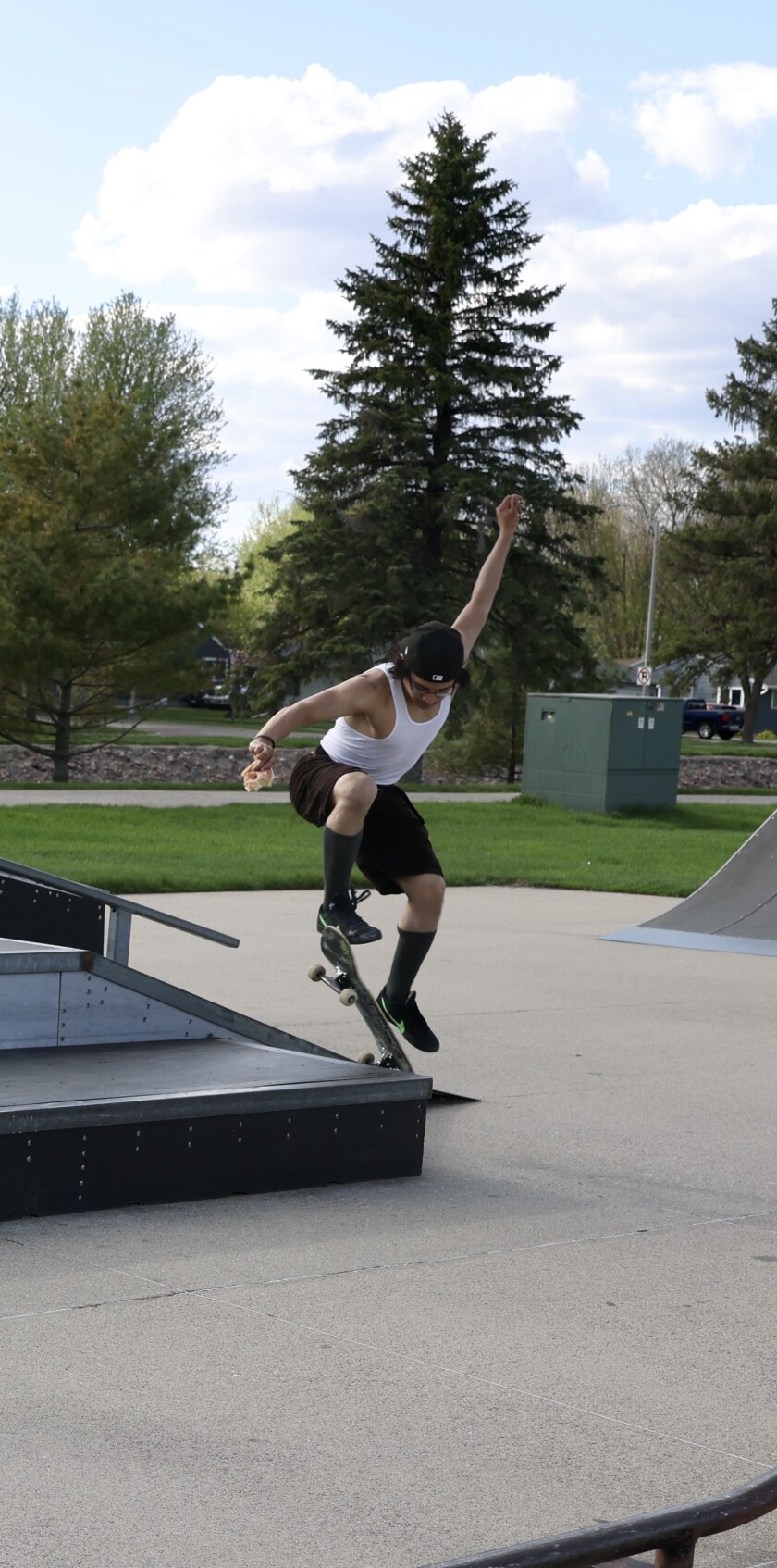 Skateboarder Edgar Padilla attempts a trick at Worthington's local park on Sunday, May 15, 2022.