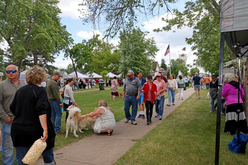 People attend Arts in the Park on Sunday, June 26, 2022, at Gregory Park in Brainerd.