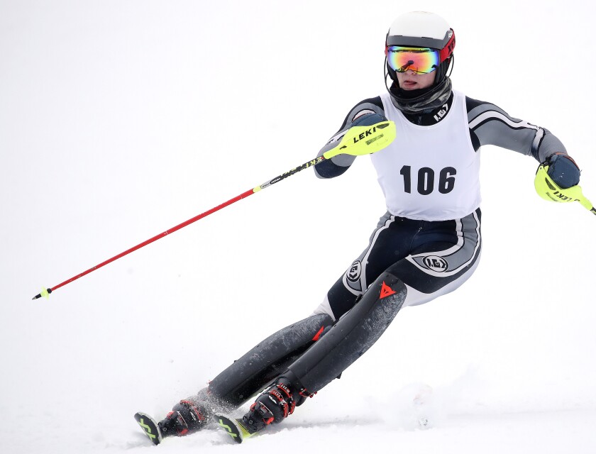 Skier races downhill