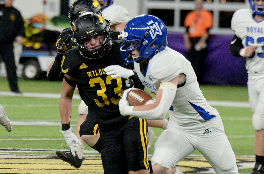 NLS senior Hunter Downey, 33, chases down a Watertown-Mayer ball carrier during the Class AAA state semifinals on Saturday, Nov. 19, 2022 at U.S. Bank Stadium in Minneapolis.