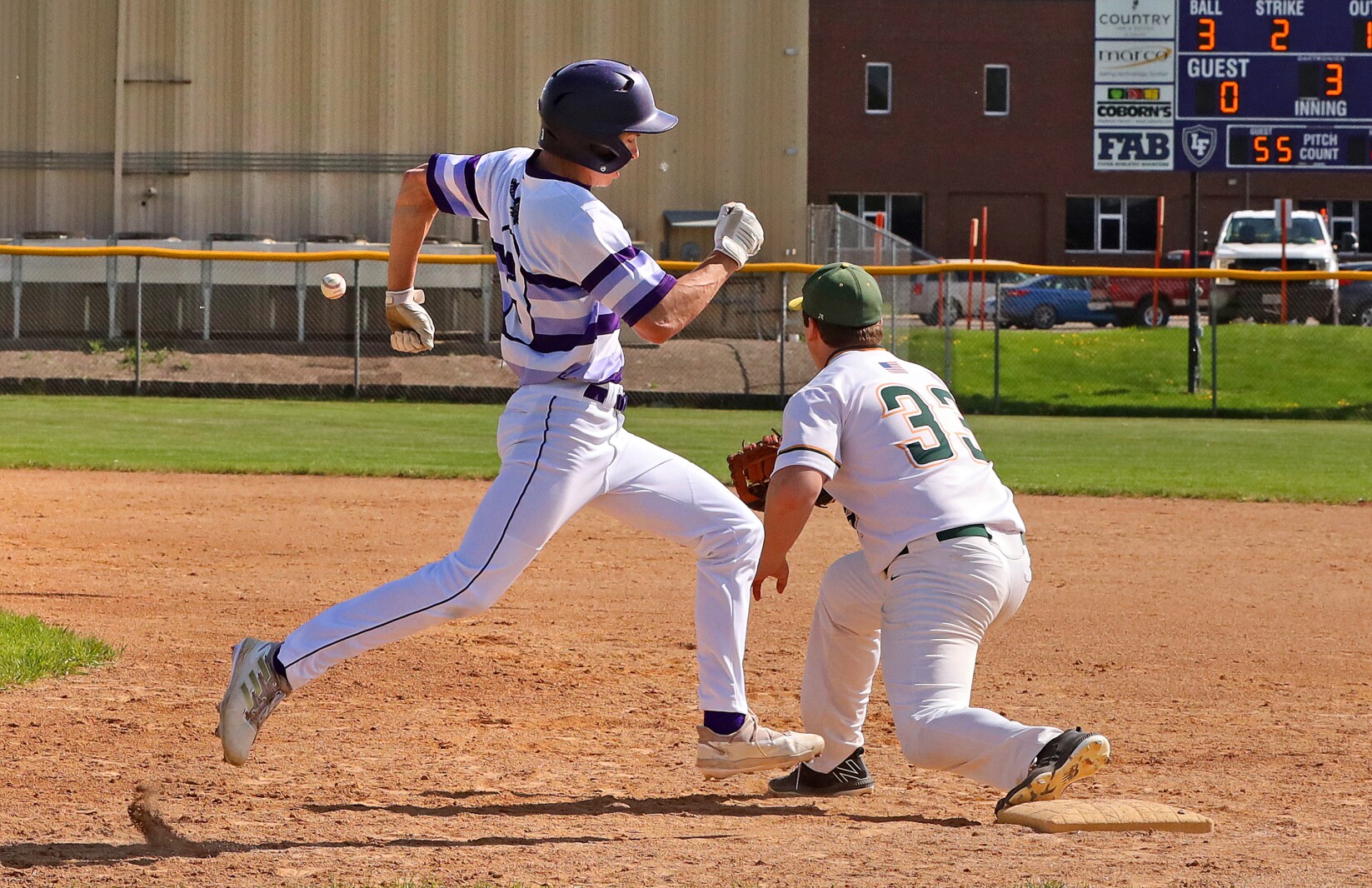 Little Falls' Owen Bode gets safely to first base against Sauk Rapids on Friday, May 27, 2022, at Little Falls.