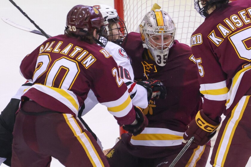 college men play ice hockey