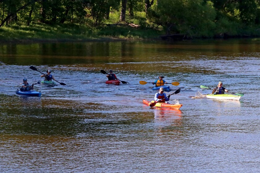 Racers head up the Mississippi River on Saturday, July 30, 2022, going from Kiwanis Park to Evergreen Landing and back again in Brainerd.