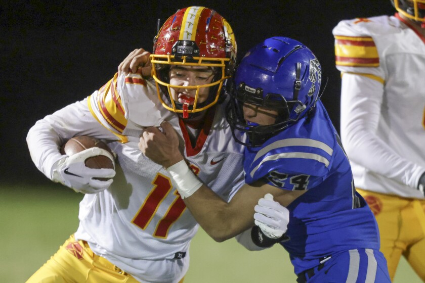 high school boys playing football