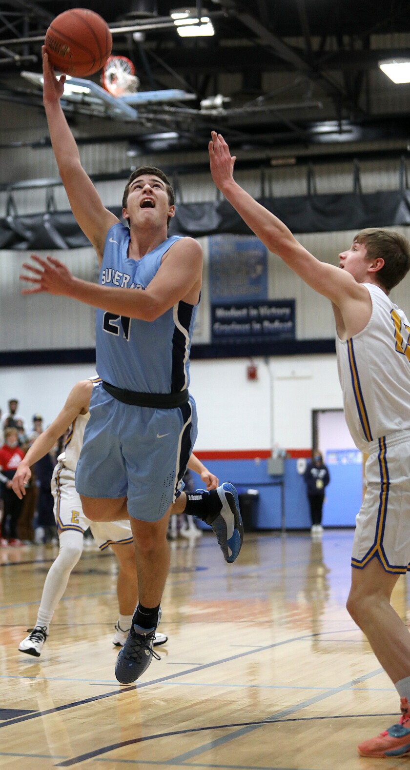 Superior’s Robert Olson (21) scores over Esko’s Nicholas Swanson (13)