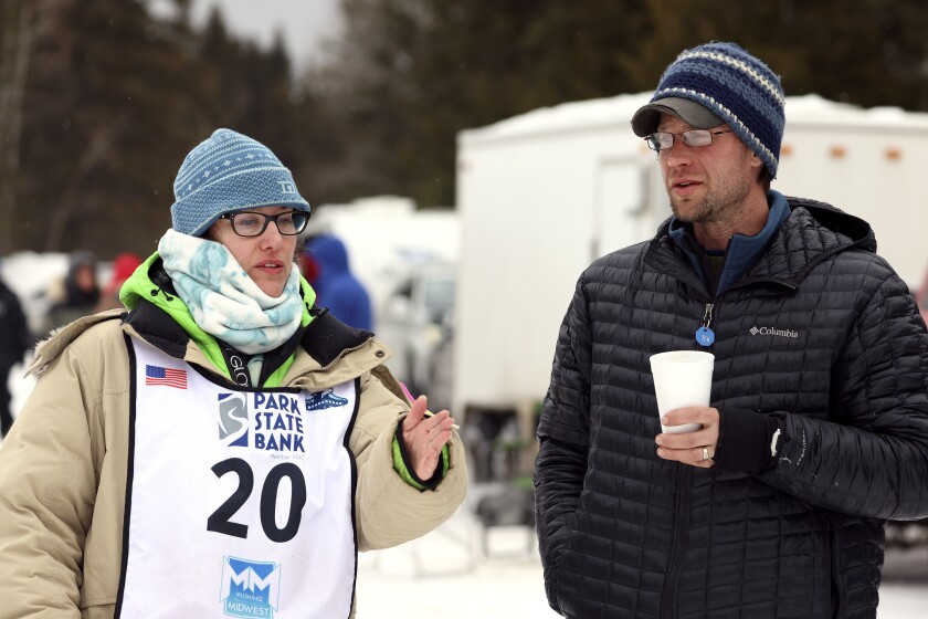 Two mushers visit.