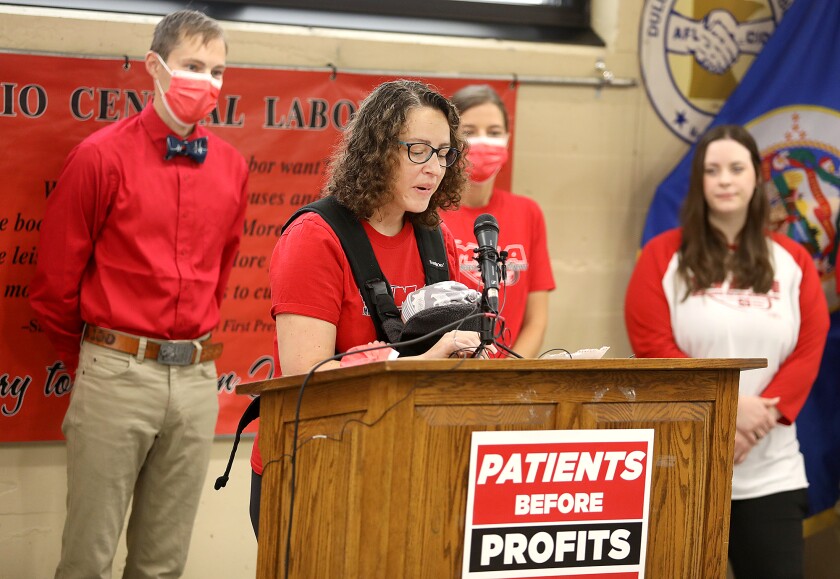 Andrea Rubesch, RN at St. Luke’s, speaks at a press conference at the Duluth Labor Temple