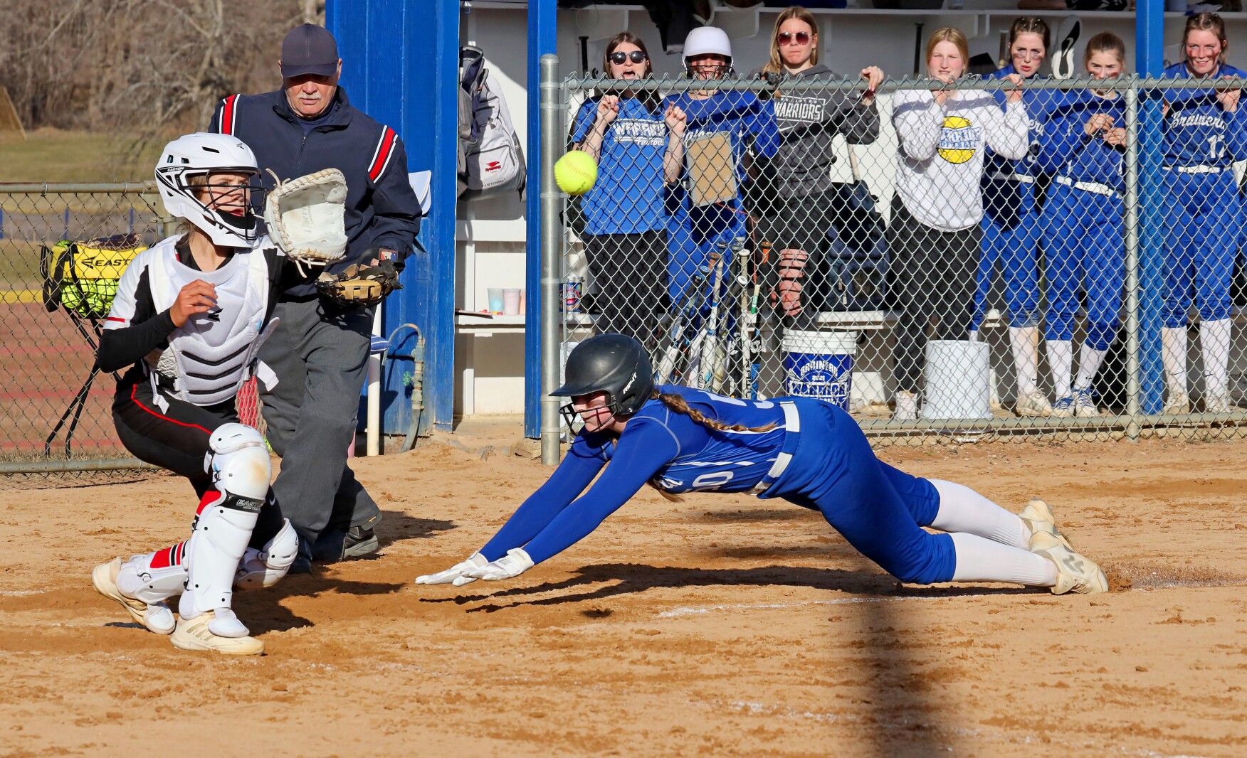 Brainerd softball player slides safely into home.