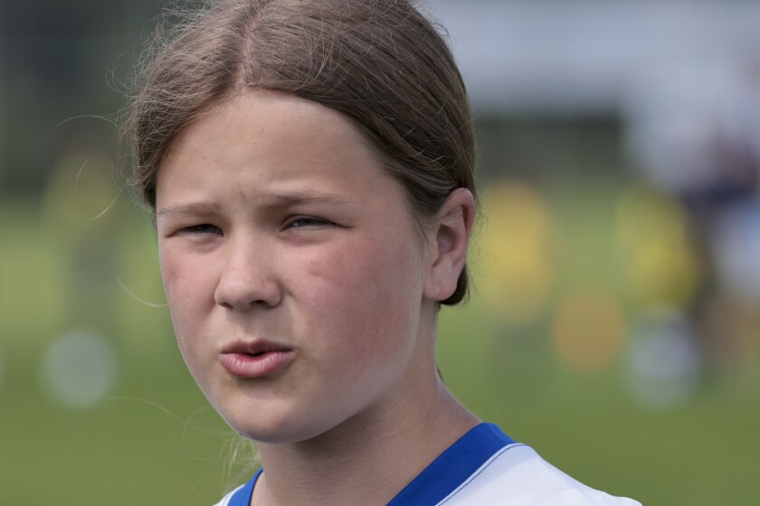 Soccer players in blue and yellow jerseys