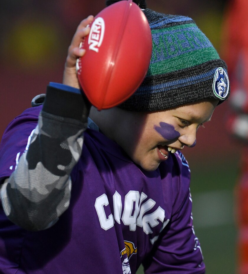 Cloquet’s Gentry Olson spikes the ball after scoring a touchdown against Duluth East