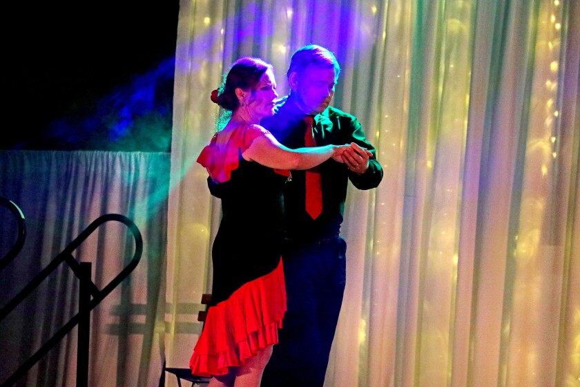 Dancer perform on stage.