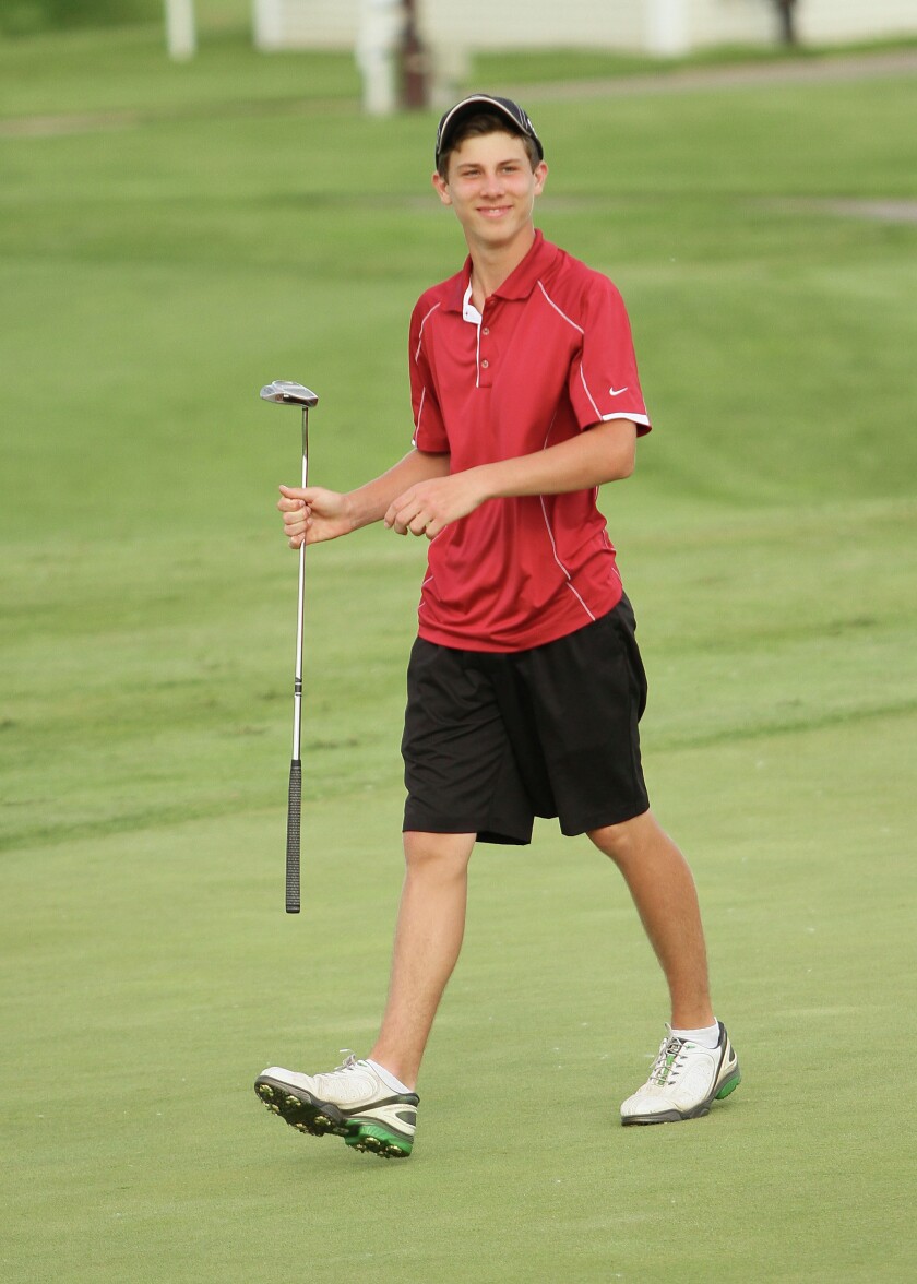 Bill Johnson Photo / Andrew Israelson of Staples-Motley walks off the green after finishing his round in the 2014 Class 2A state boys golf tournament.