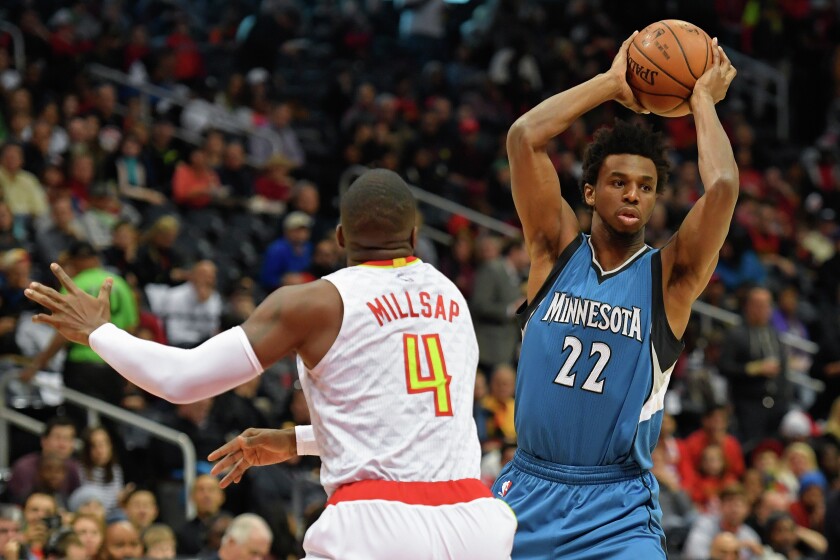 Minnesota Timberwolves forward Andrew Wiggins (22) looks to pass the ball in front of Atlanta Hawks forward Paul Millsap (4) during the first half at Philips Arena on Wednesday night. Photo by Dale Zanine-USA TODAY Sports