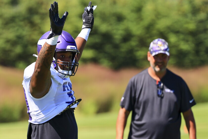 Professional football players practice at outdoor field