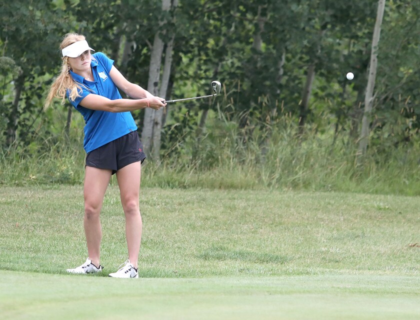 Superior’s Autumn Cooper chips onto the green on the third hole