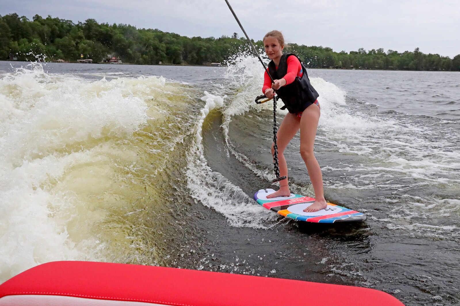 Savannah Mendell demonstrates wake surfing for people during the ninth annual Bar Harbor In-Water Boat Show on Saturday, June 18, 2022, on Gull Lake. Watercraft for the boat show were brought by Nisswa Marine and Minnesota Inboard Water Sports and a Wake Responsibly event taught attendees boat safety and responsibility.