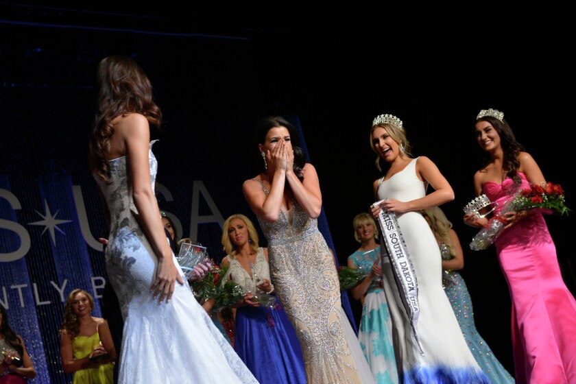 Tessa Dee, of Mitchell, reacts as she was crowned Miss South Dakota USA on Sunday night. She will go on to compete in the Miss USA competition sometime next year. (Photo courtesy of Future Productions)
