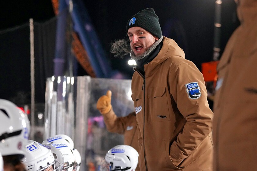 Brainerd/Little Falls' head coach Tate Rusk cheers on his team on Thursday, Jan. 23, 2025, during Hockey Day Minnesota at Valleyfair.
