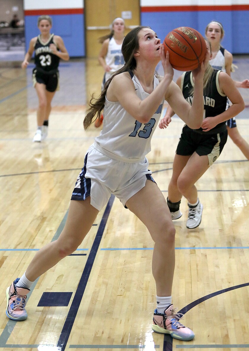 Superior’s Kloe Zentkowski (13) gets a shot up in the second half