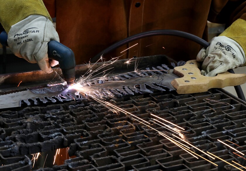 Ed Hakanson makes a tree out of an old saw with his plasma cutter