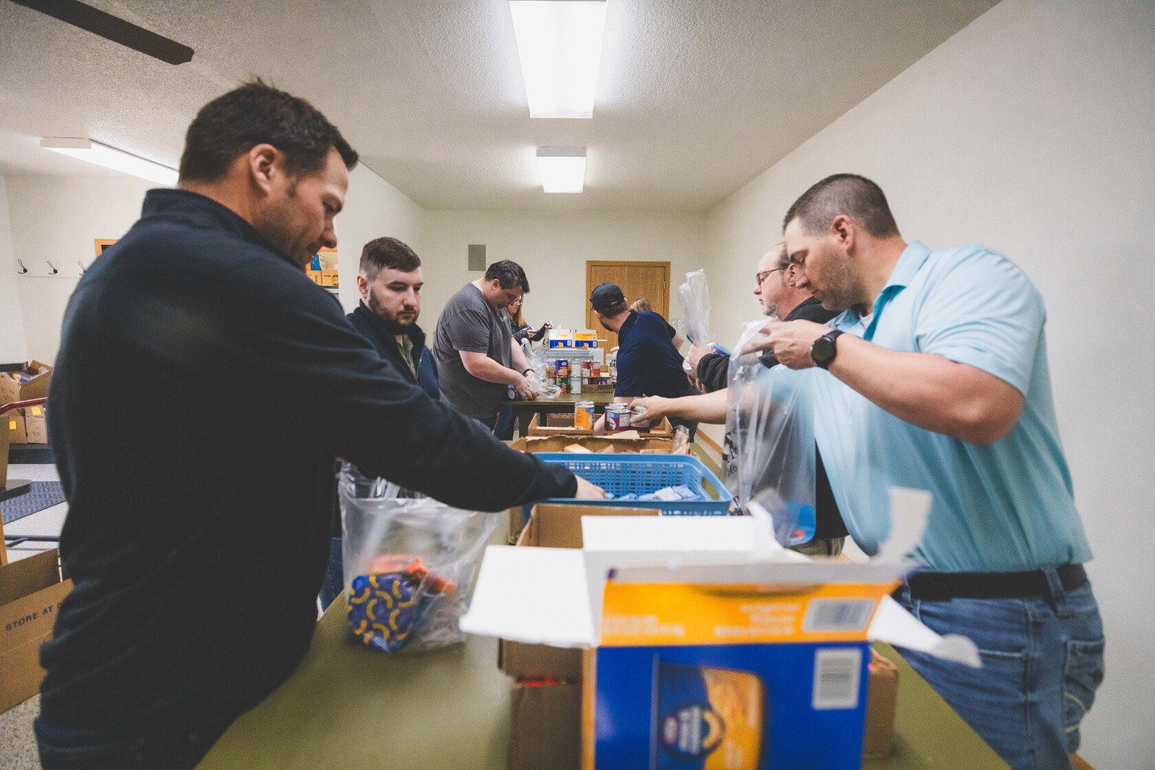 PHOTOS: Mitchell Republic staff volunteers to pack food bags for ...