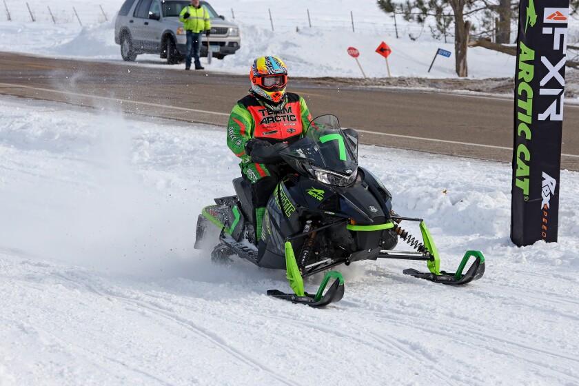 Snowmobilers race