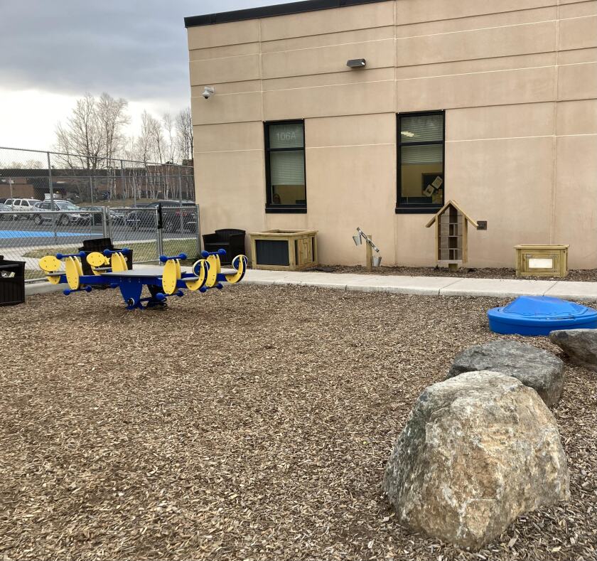 Mobile playground features line the side of the Hawks Nest playground along with a permanent bounce feature.