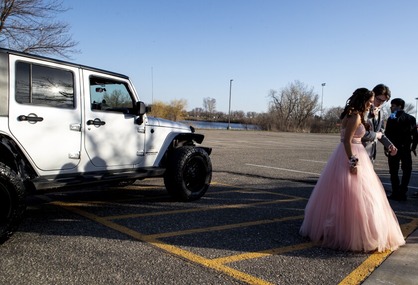 Willmar High School prom attendees depart their car during grand march on Friday, May 6, 2022.