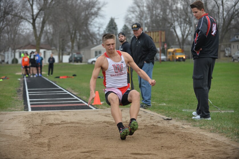 Willmar's Noah Slagter lands in the pit during the long jump competition on Thursday at the Willmar Invitational. Curt Hogg / Tribune