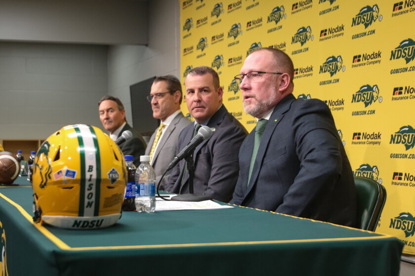 From right to left: NDSU head football coach Tim Polasek, NDSU director of athletics Matt Larsen, 15th NDSU president David Cook, and interim NDSU president Rick Berg speak during a press conference on Monday, Feb. 9, 2026, at the Sanford Health Athletic Complex in north Fargo to announce NDSU football joining the Mountain West Conference as an affiliate member for football, competing at the Football Bowl Subdivision level beginning this fall.