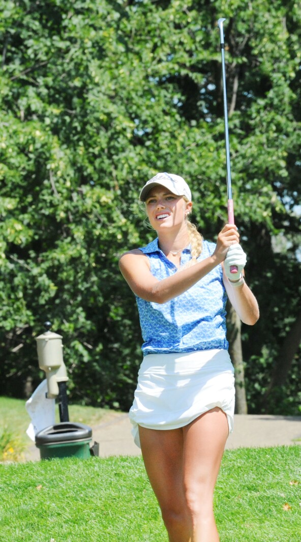 Leah Skaar watches her tee shot at hole No. 7 land during her qu